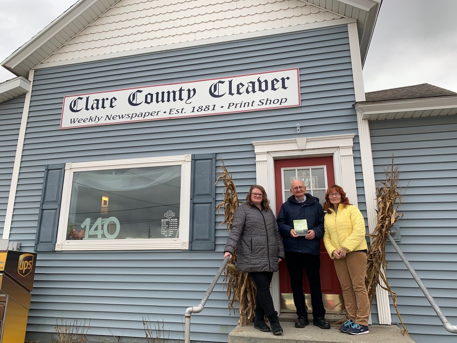 Angela Kellogg, authors Pat Commins and Elizabeth Rice gather on the steps of the Clare County Cleaver during the authors’ recent visit to Clare County.